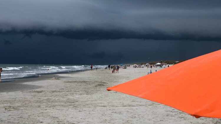 dark strom clouds and orange umbrella