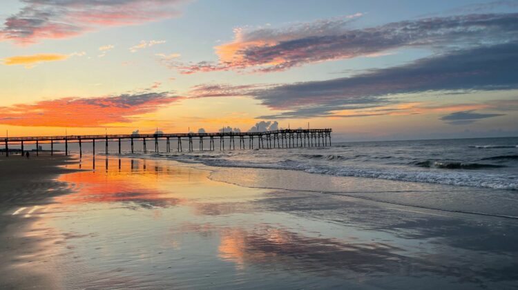 sunrise at the beach on the water