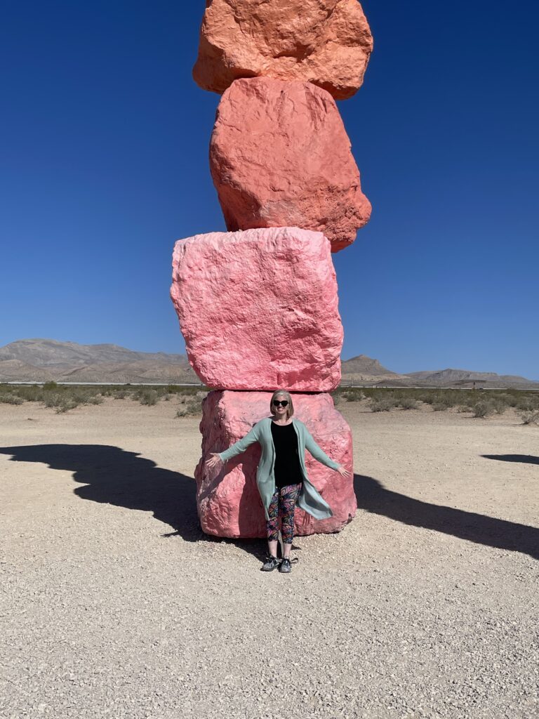 Emily in front of "Seven Magic Mountains" stacked stone statue